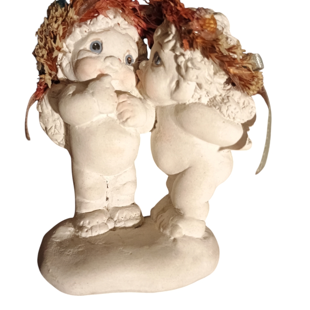 White Cherub Sculpture with Childlike Figures and Whimsical Style